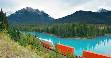 Freight train crossing Canadian landscape