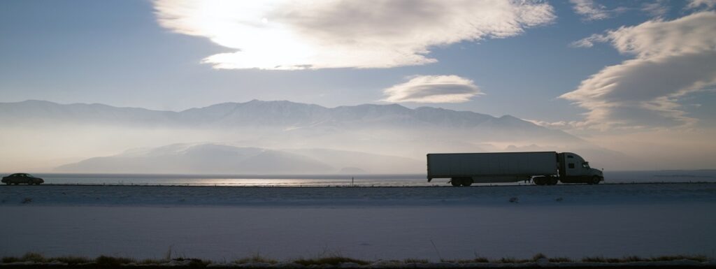 Long Haul Over the Road Freight Trucking Winter Highway