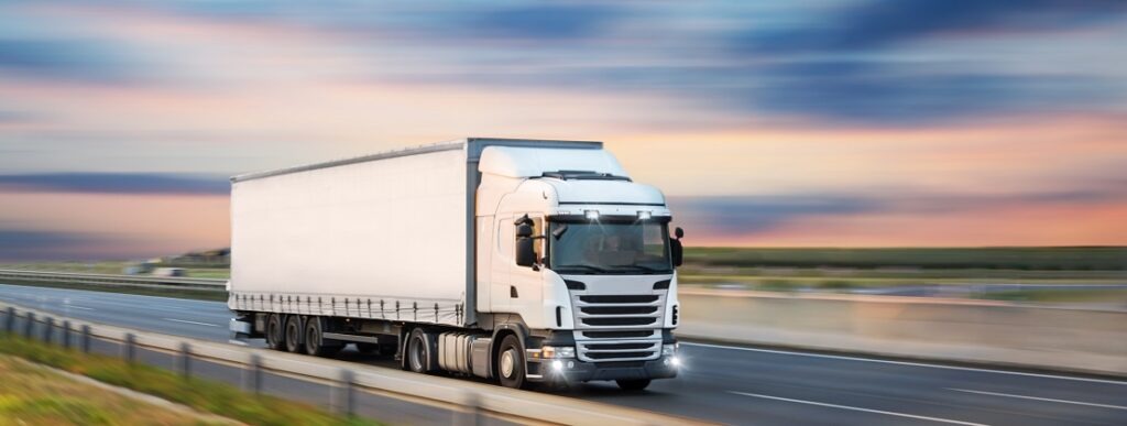 Truck with container on road