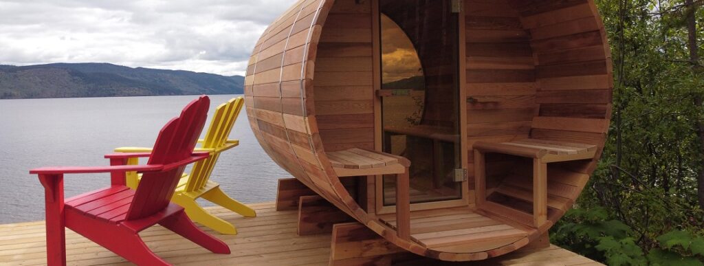 An outdoor hot tub on a pier next to a lake