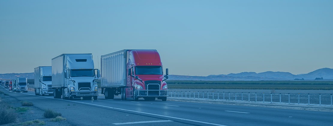 A 53' truck driving down a highway towards the screen