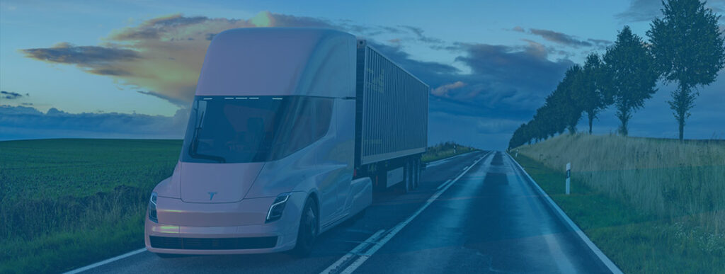 An electric truck hauling freight by road