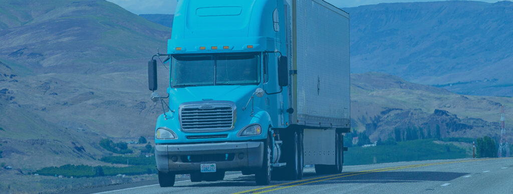 Dry van truck moving by road