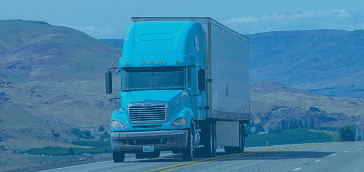 Dry van truck moving by road